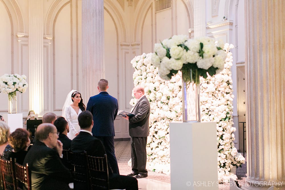 Wedding Ceremony Photo with Floral Wall