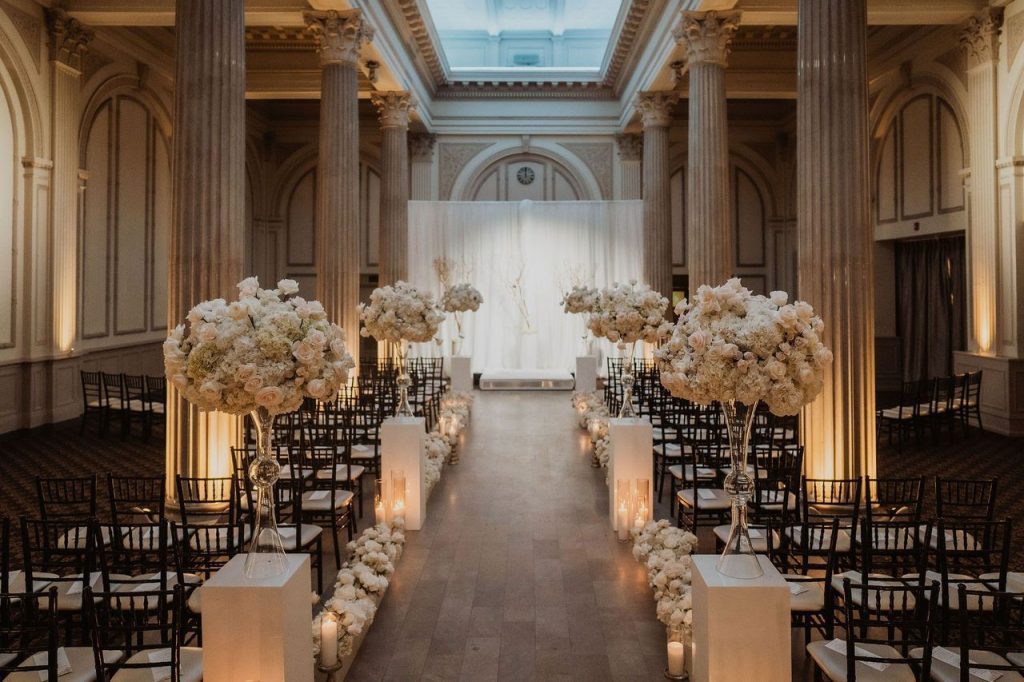 White florals down the wedding aisle