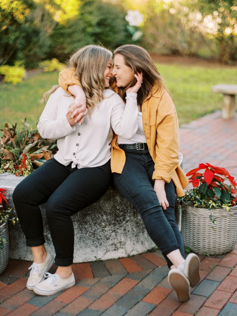 Engaged couple sitting for engagement pictures in St. Augustine