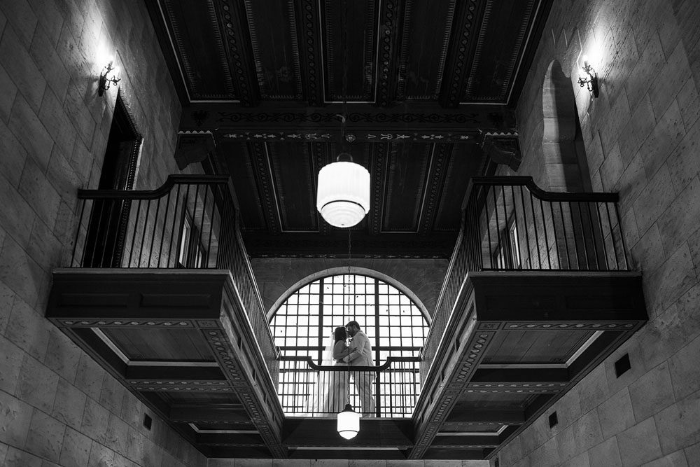 Couple sharing a first look in the Grand Foyer at The Treasury on the Plaza.