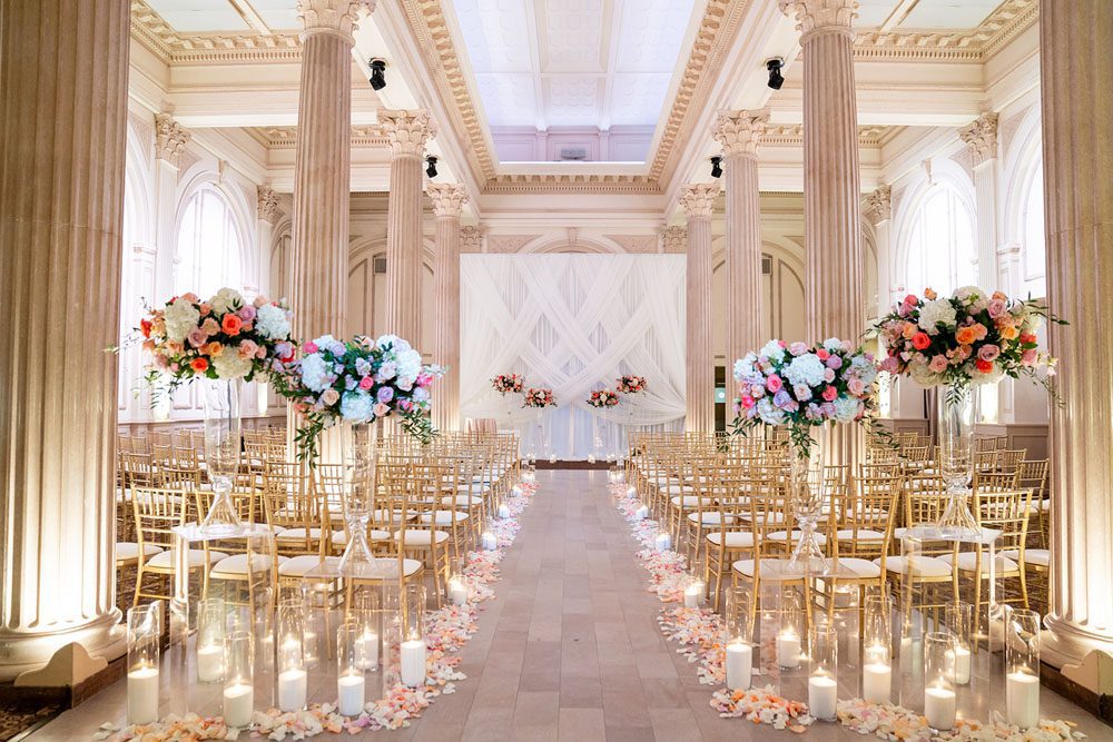 Romantic ceremony setup in the Grand Ballroom at The Treasury on the Plaza