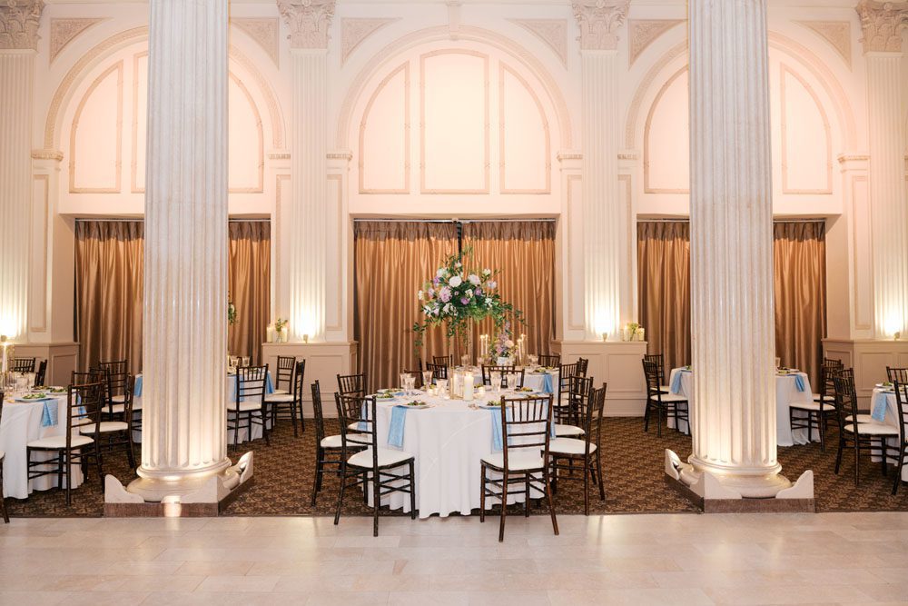 Reception tables beneath elegant lighting inside the Grand Ballroom.