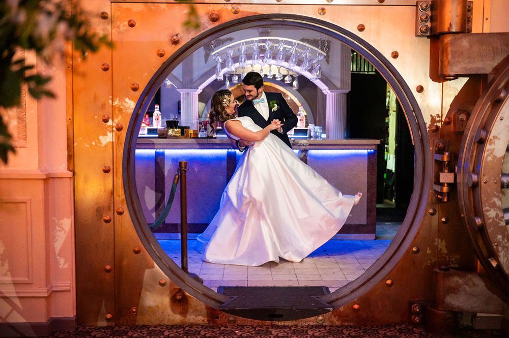 Newlyweds sharing a quiet moment inside the Vault Bar